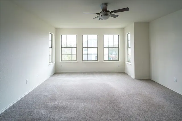 a bathroom with a tub a double vanity sink and mirror