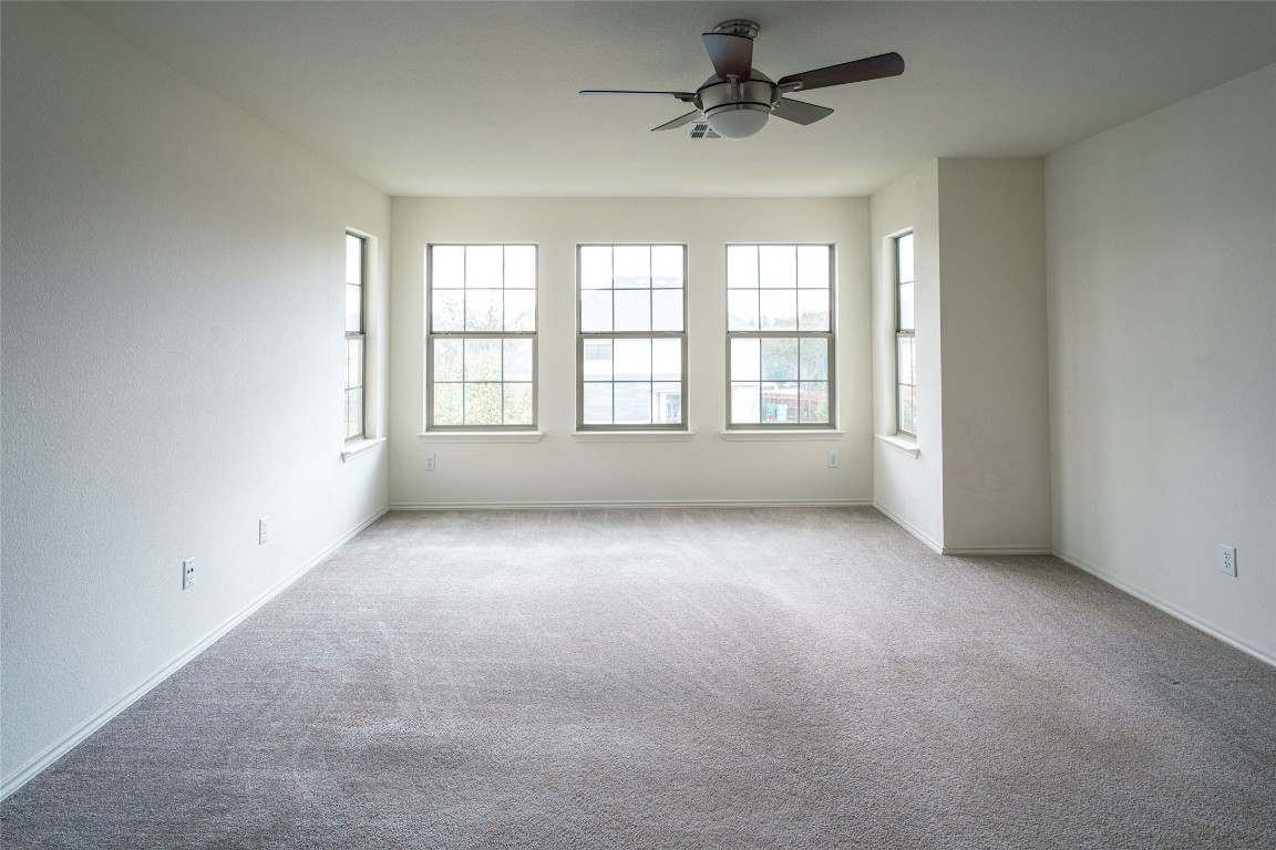 612 Dark Tree Lane Round Rock, TX 78664 - Photo 28 of 40 an empty room with a empty space and windows