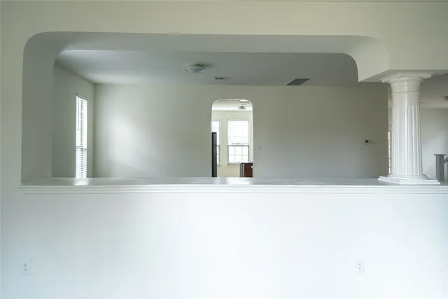 a view of empty room with windows