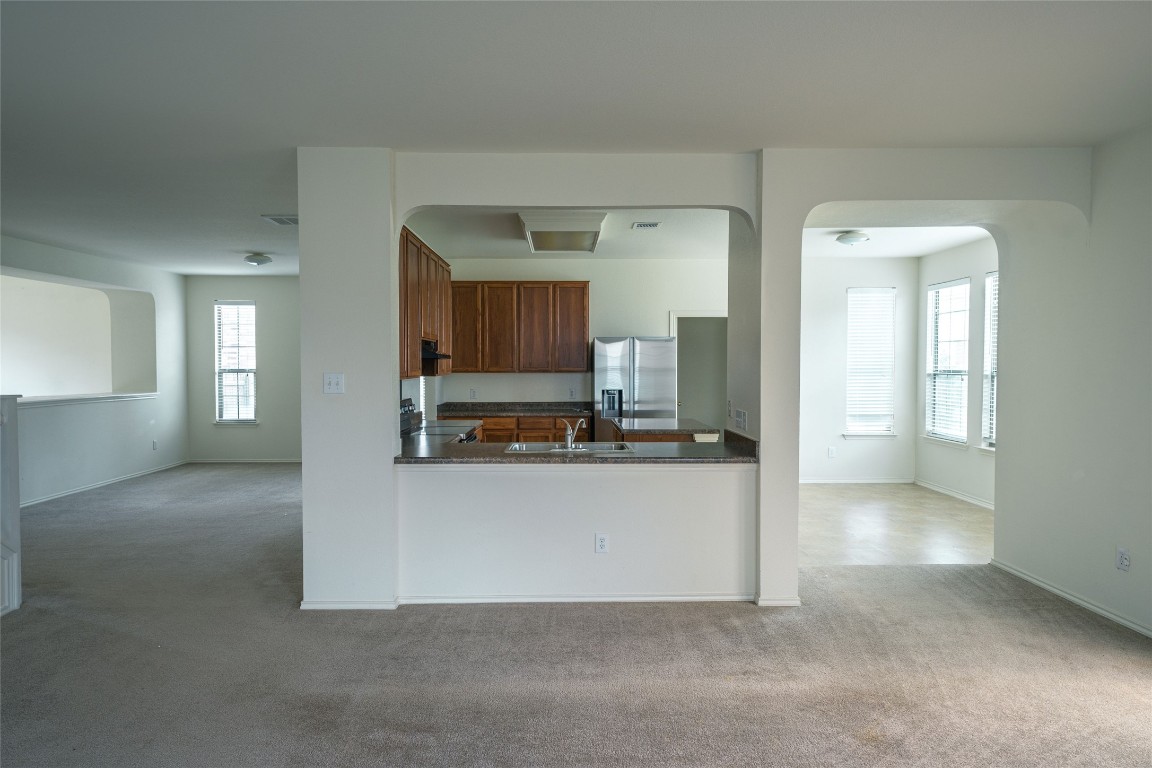 612 Dark Tree Lane Round Rock, TX 78664 - Photo 10 of 40 a view of a living room with furniture and a flat screen tv