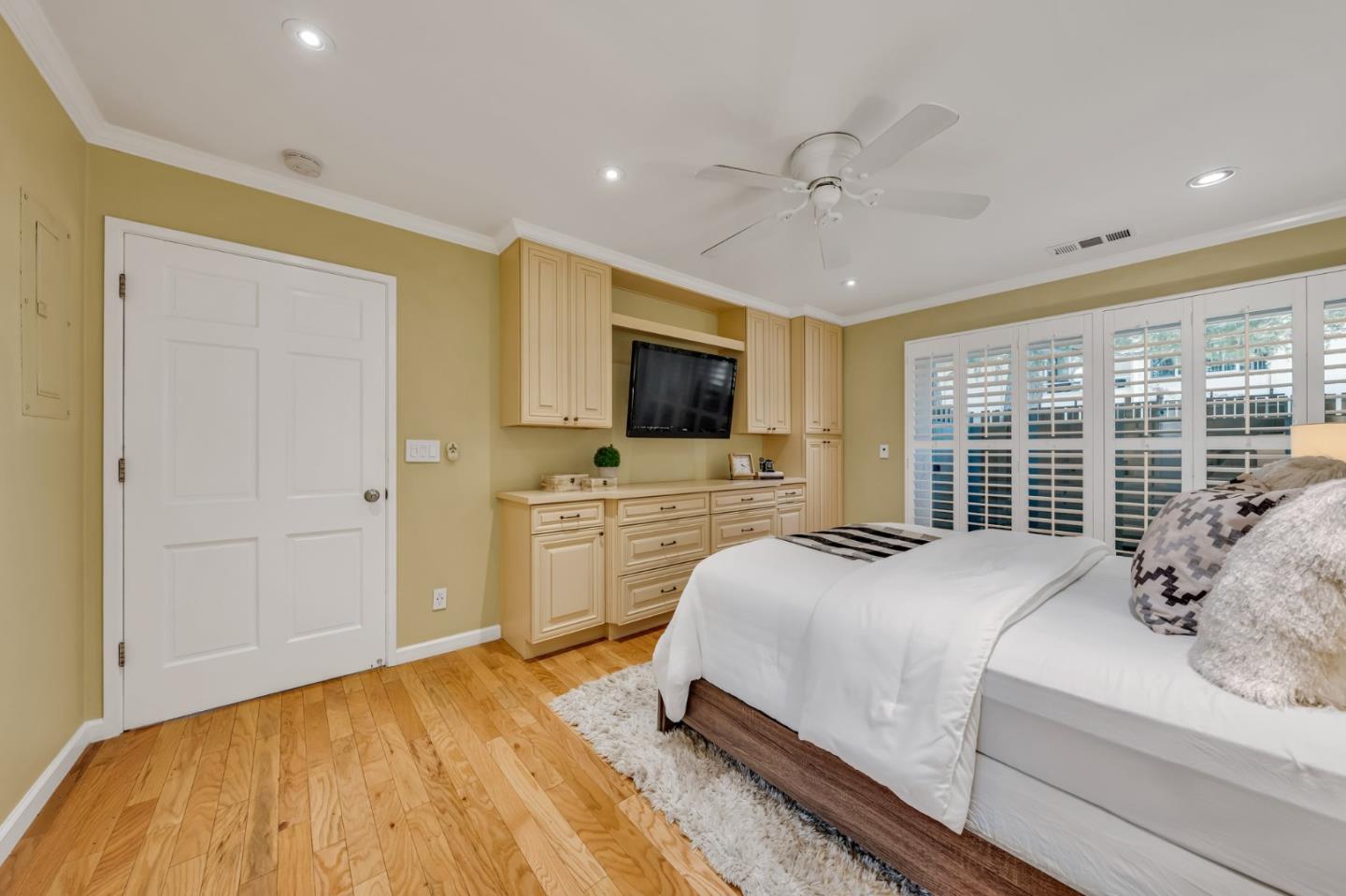 8 Los Altos Square Los Altos, CA 94022 - Photo 21 of 53 a spacious bedroom with a bed and a flat screen tv