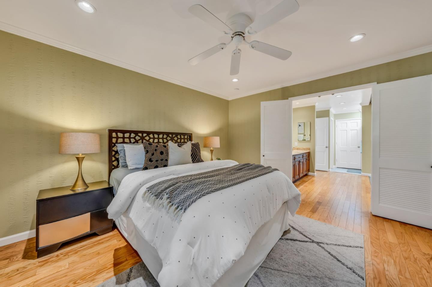 8 Los Altos Square Los Altos, CA 94022 - Photo 30 of 53 a bedroom with a bed and wooden floor