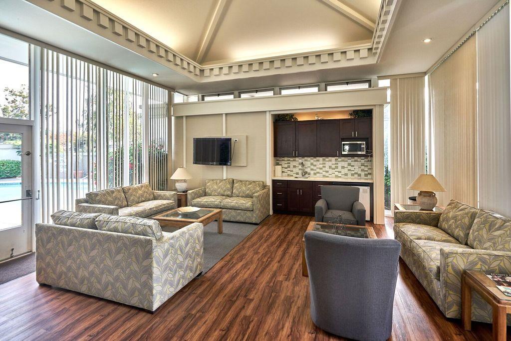 8 Los Altos Square Los Altos, CA 94022 - Photo 39 of 53 a living room with furniture and a fireplace