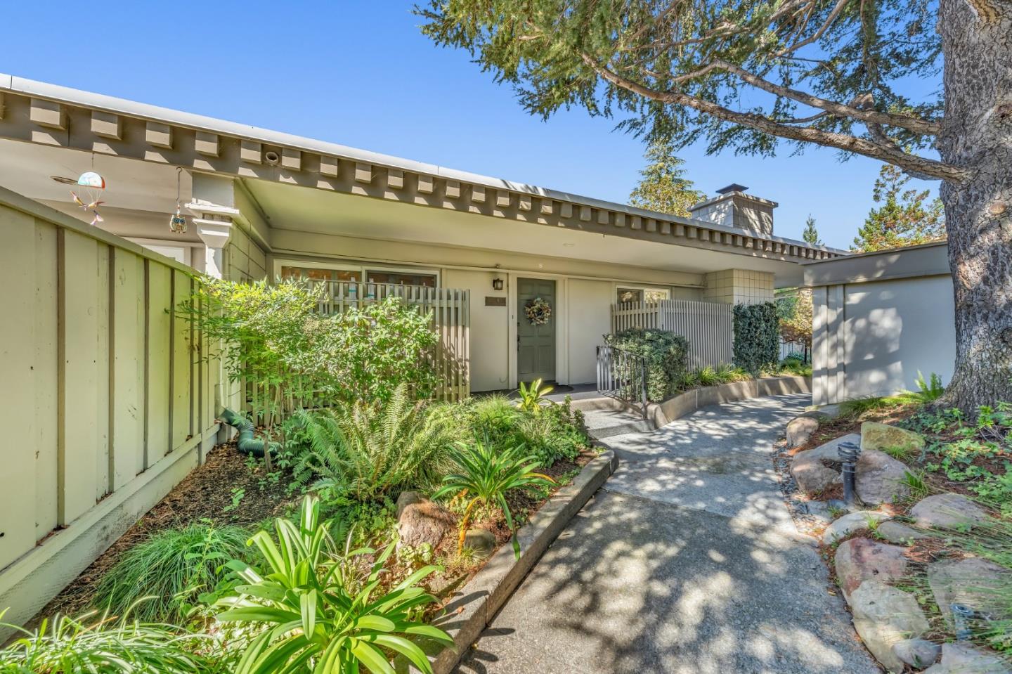 8 Los Altos Square Los Altos, CA 94022 - Photo 4 of 53 a front view of a house with garden