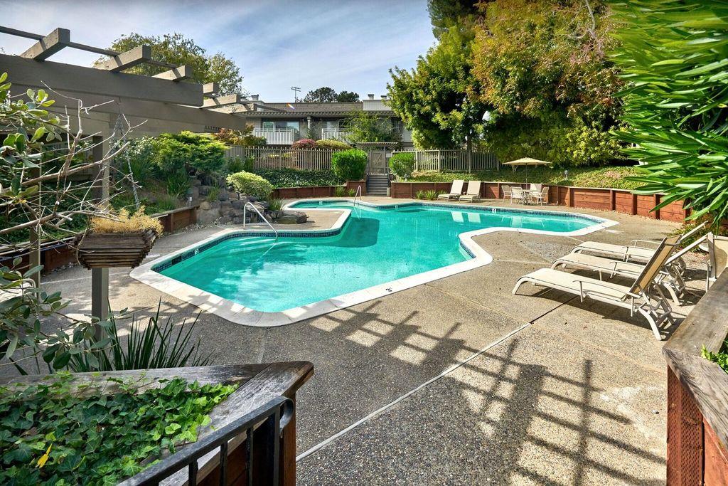 8 Los Altos Square Los Altos, CA 94022 - Photo 48 of 53 a view of a swimming pool with a patio