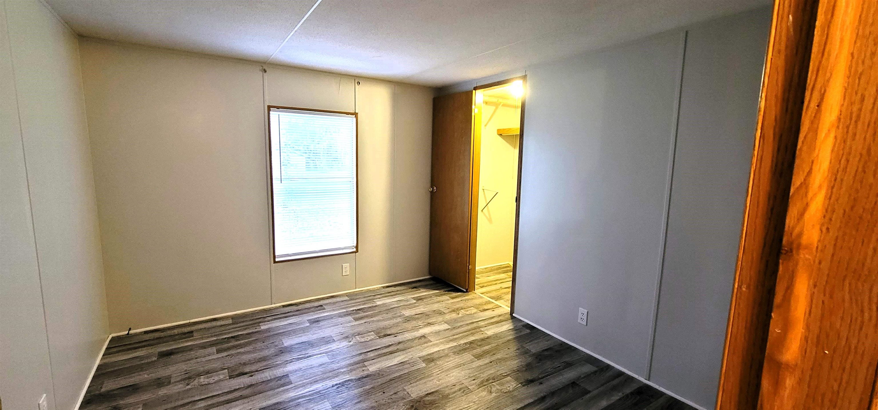 4920 Porter Road St. Augustine, FL 32095 - Photo 11 of 15 a view of an empty room with wooden floor and a window