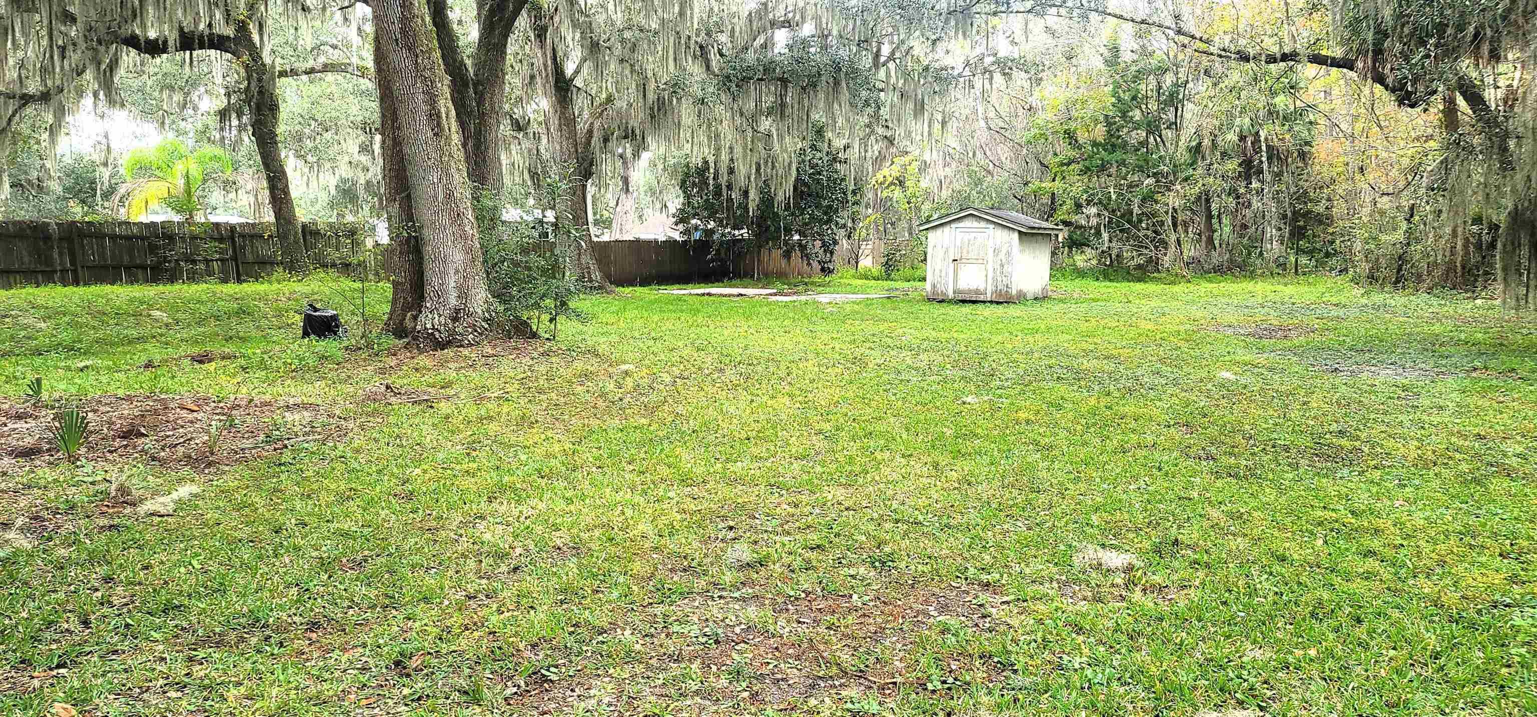4920 Porter Road St. Augustine, FL 32095 - Photo 14 of 15 a view of a garden with large trees