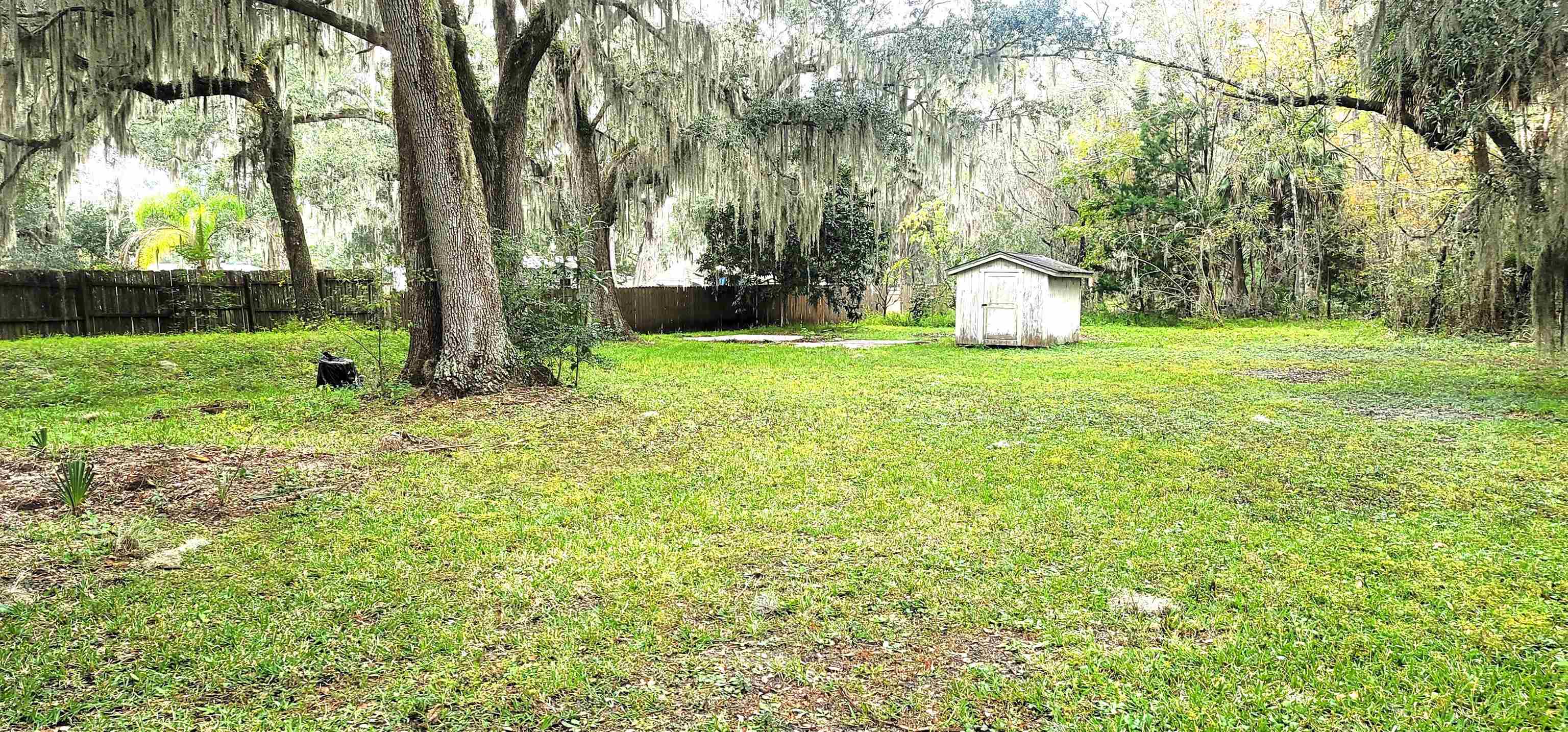 4920 Porter Road St. Augustine, FL 32095 - Photo 15 of 15 a view of a backyard with large trees and plants