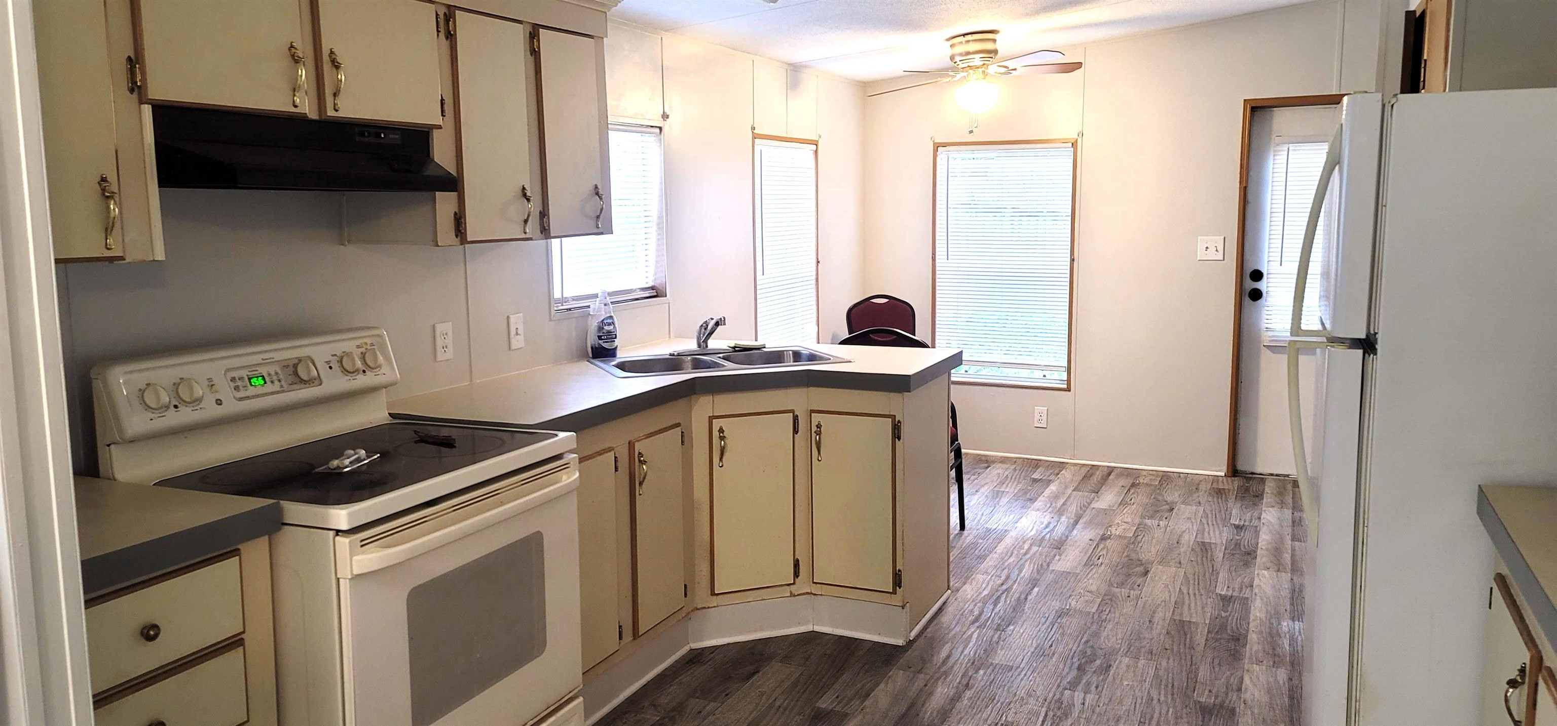 4920 Porter Road St. Augustine, FL 32095 - Photo 5 of 15 a kitchen with stainless steel appliances a stove a sink a refrigerator and cabinets
