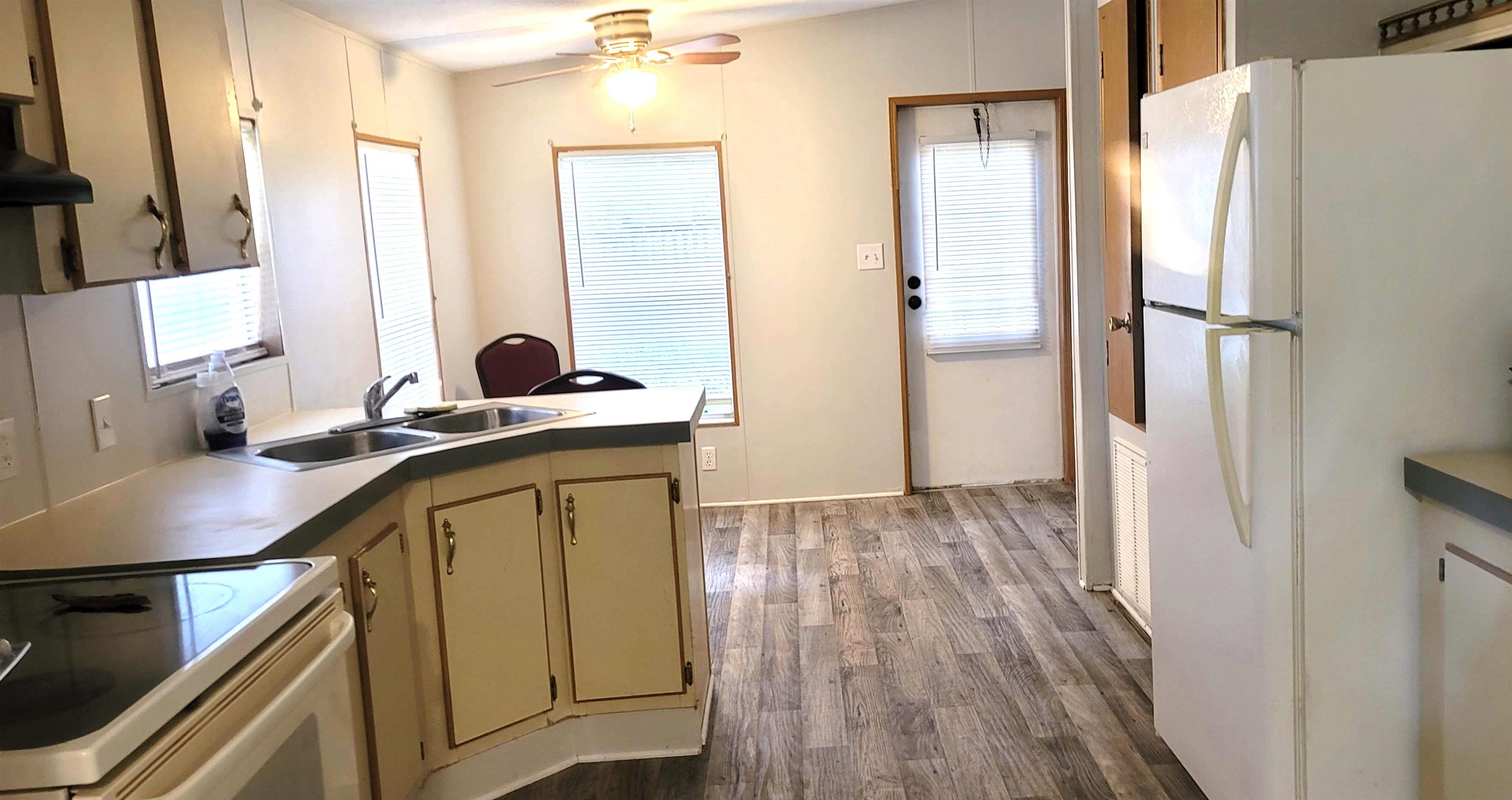 4920 Porter Road St. Augustine, FL 32095 - Photo 6 of 15 a kitchen with a sink a refrigerator a washer and dryer