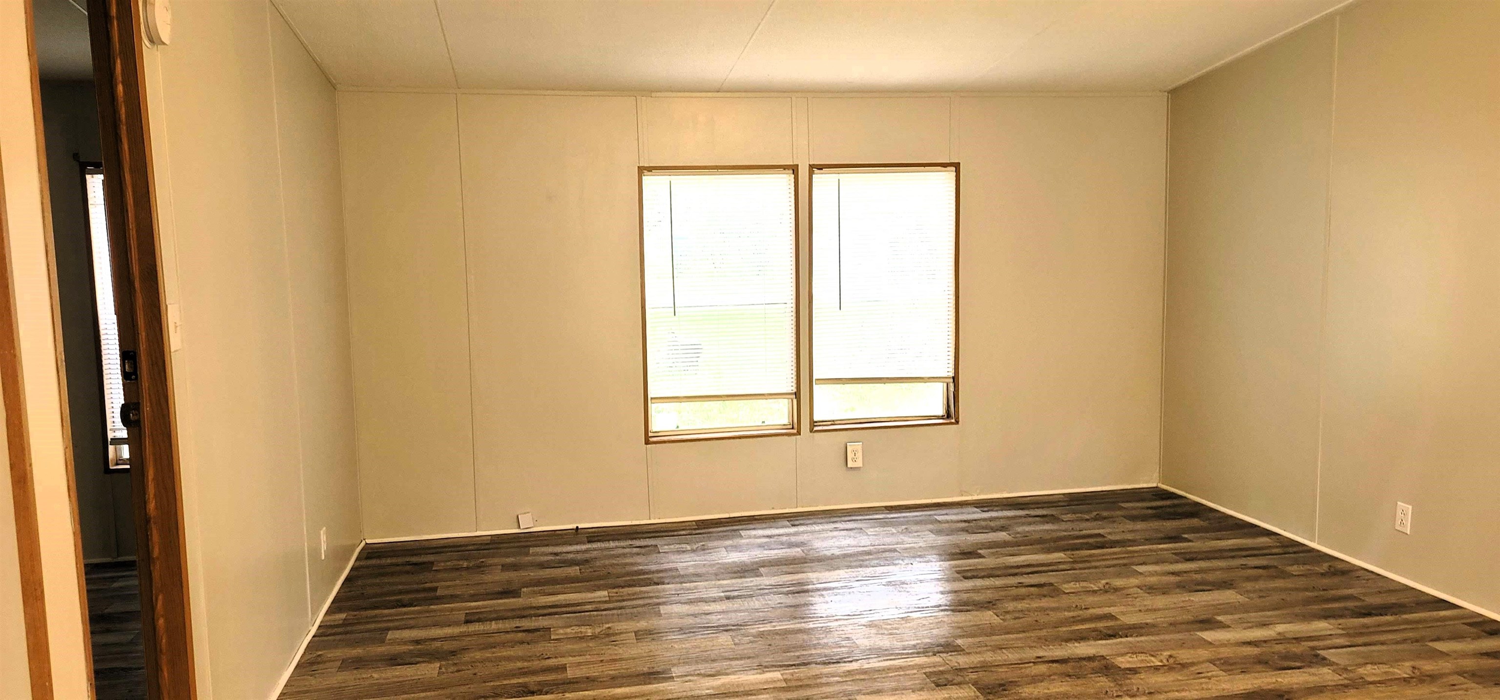 4920 Porter Road St. Augustine, FL 32095 - Photo 7 of 15 a view of an empty room with wooden floor and a window