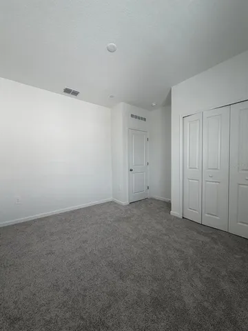 a view of an empty room and entryway