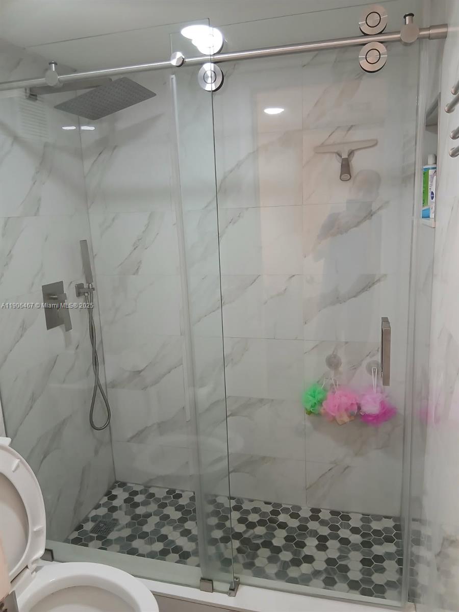 6070 West 19th Avenue, Unit 110 Hialeah, FL 33012 - Photo 3 of 9 a bathroom with a shower