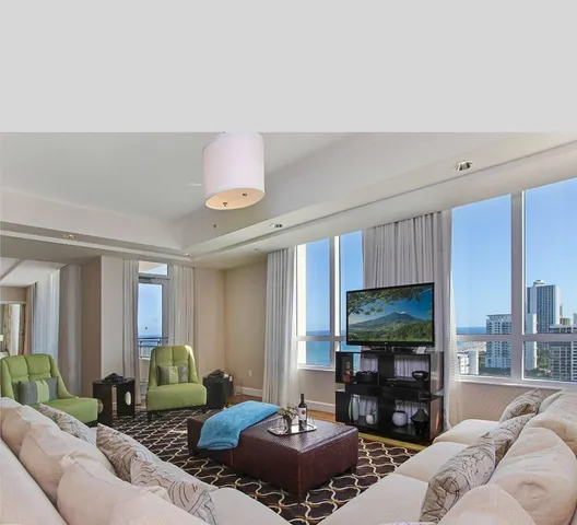 a bedroom with a bed and a dresser next to a window