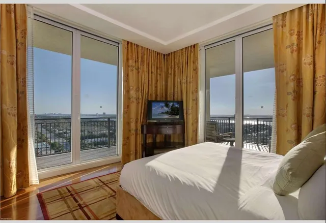 a bathroom with a double vanity sink mirror and toilet