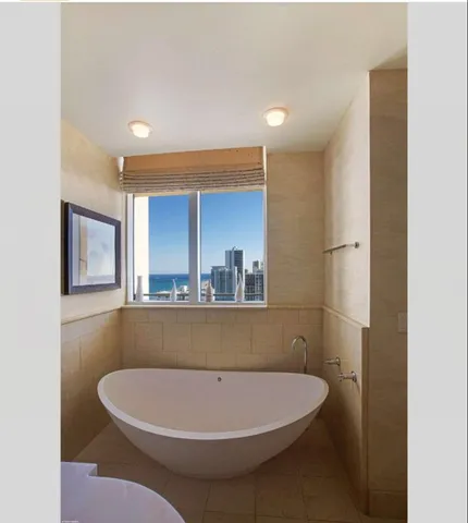a kitchen with a sink appliances and cabinets
