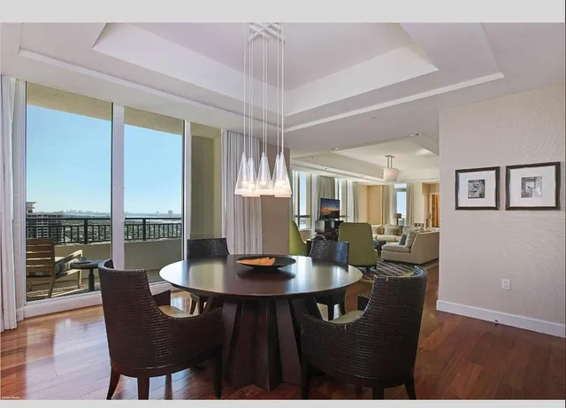a view of roof deck with wooden floor and city view