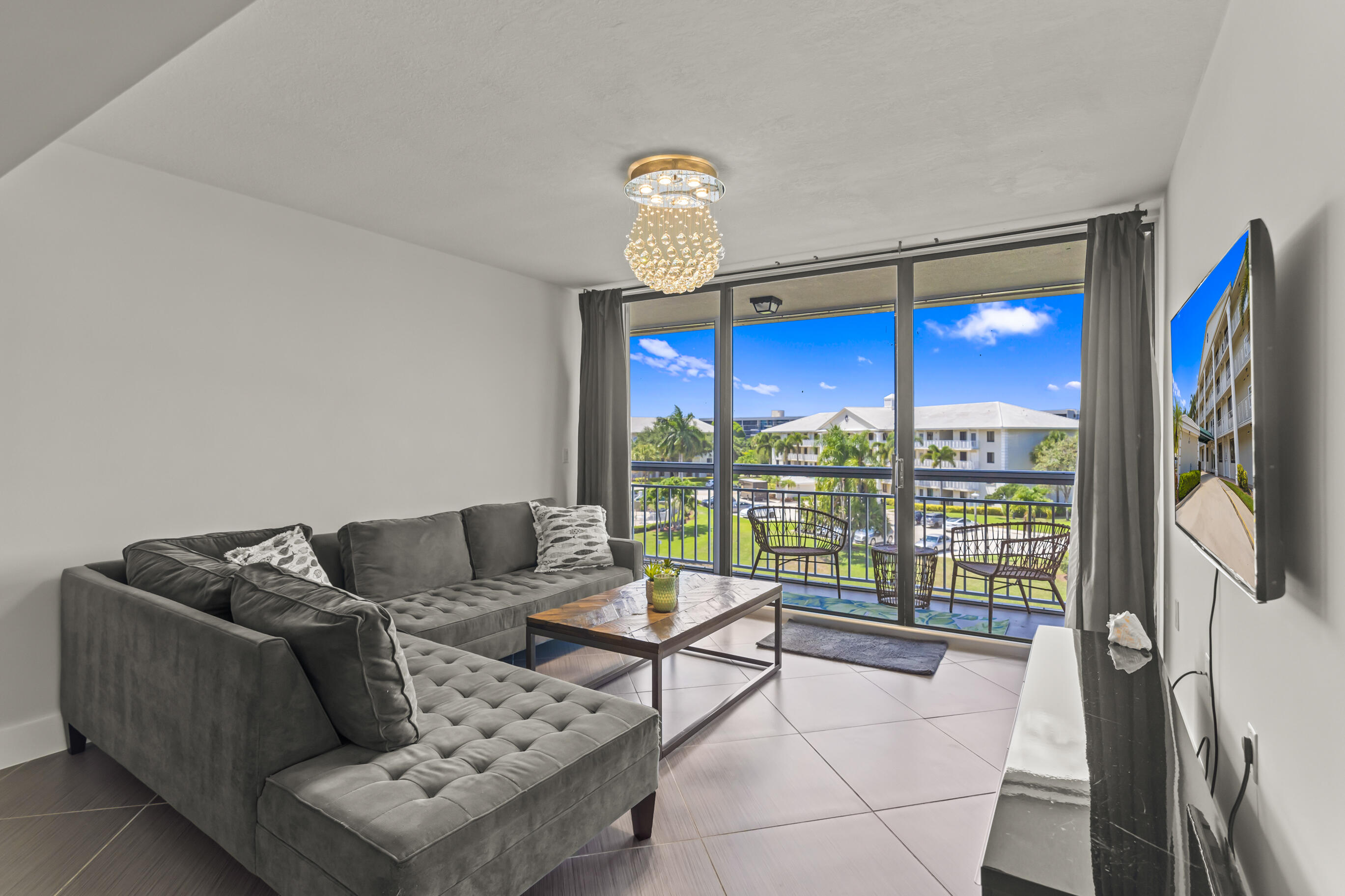 6217 Balboa Circle, Unit 404 Boca Raton, FL 33433 - Photo 1 of 42 Living Room & Balcony