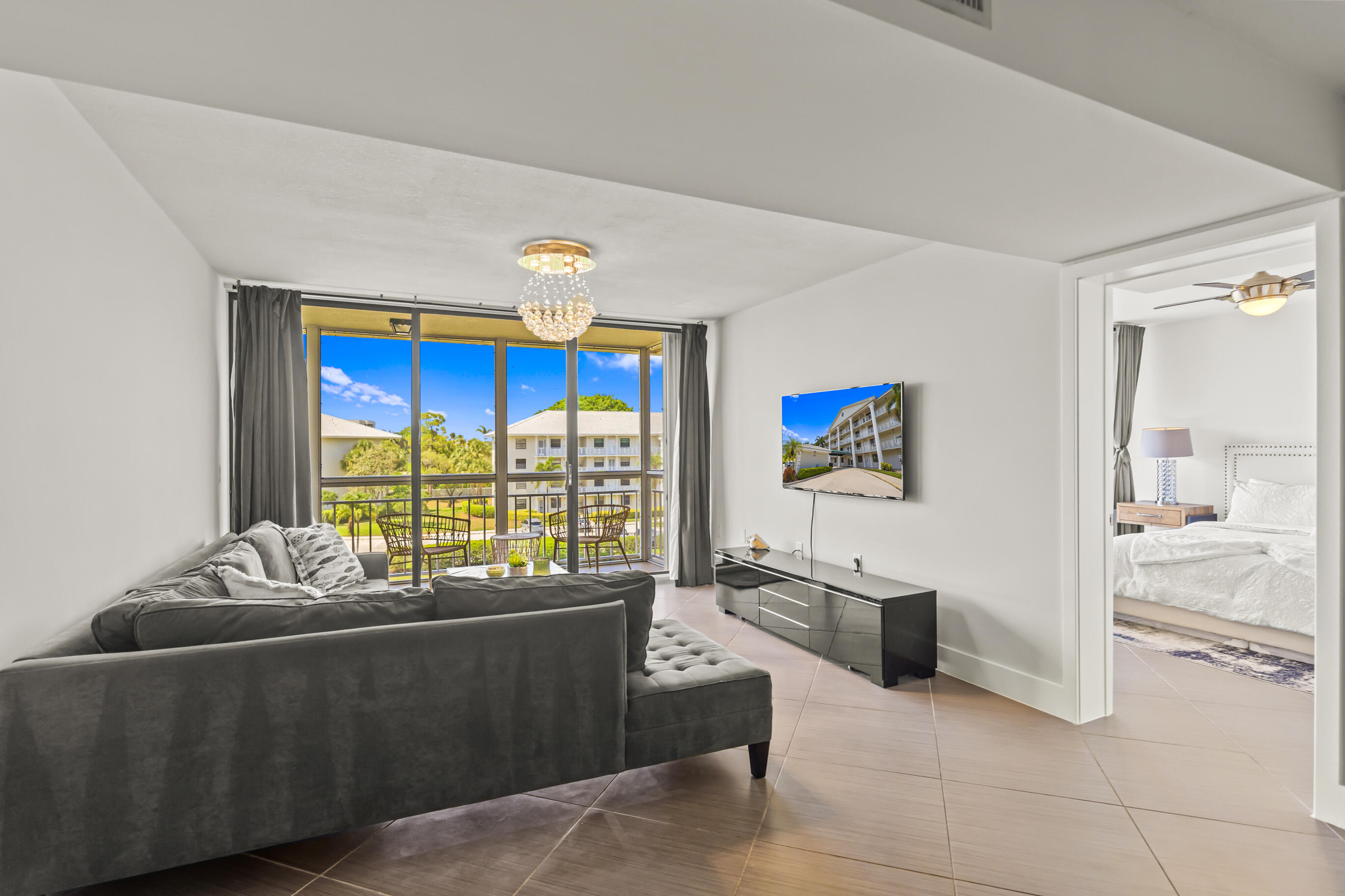 6217 Balboa Circle, Unit 404 Boca Raton, FL 33433 - Photo 2 of 42 Living Room & Balcony