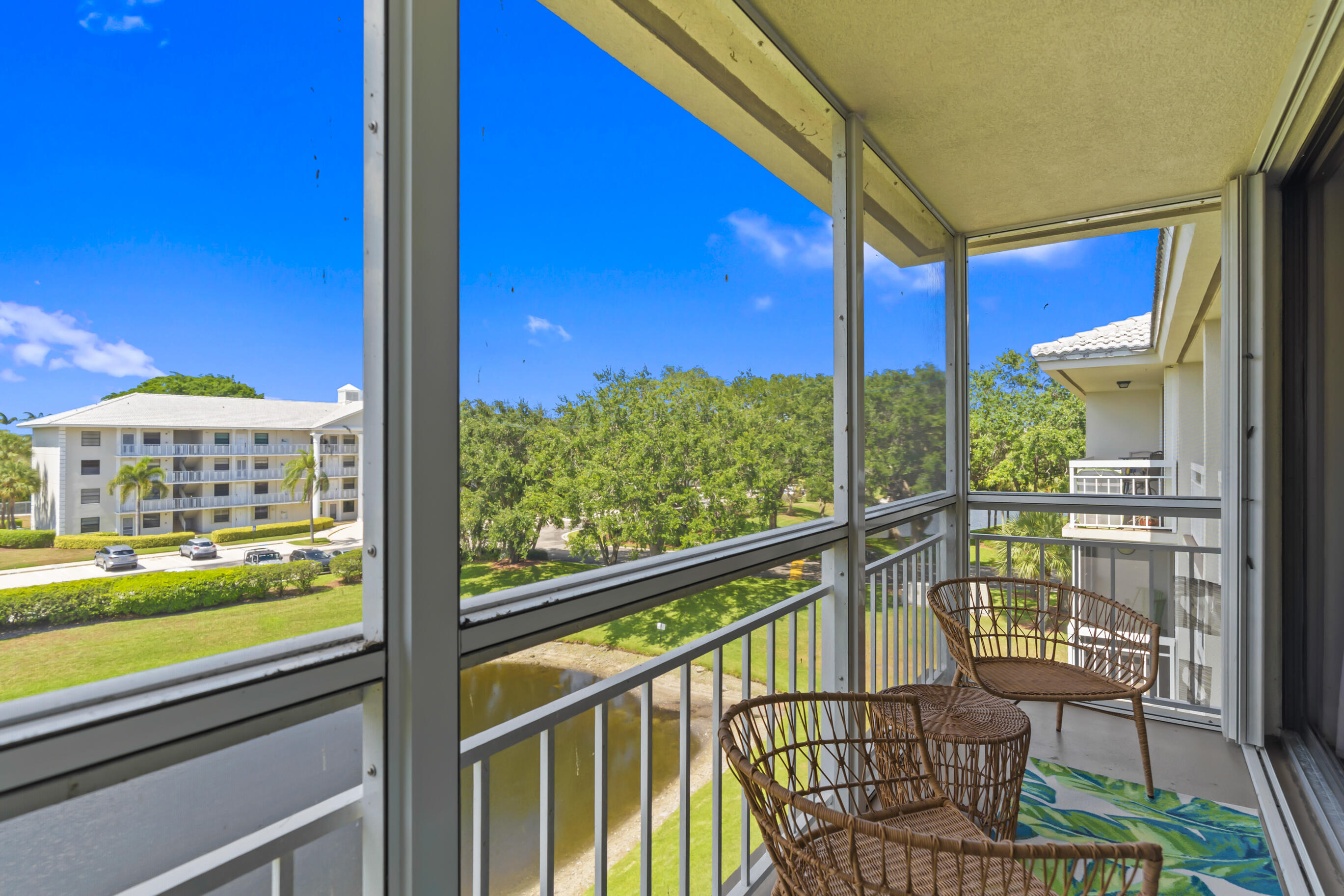 6217 Balboa Circle, Unit 404 Boca Raton, FL 33433 - Photo 6 of 42 Living Room Balcony View