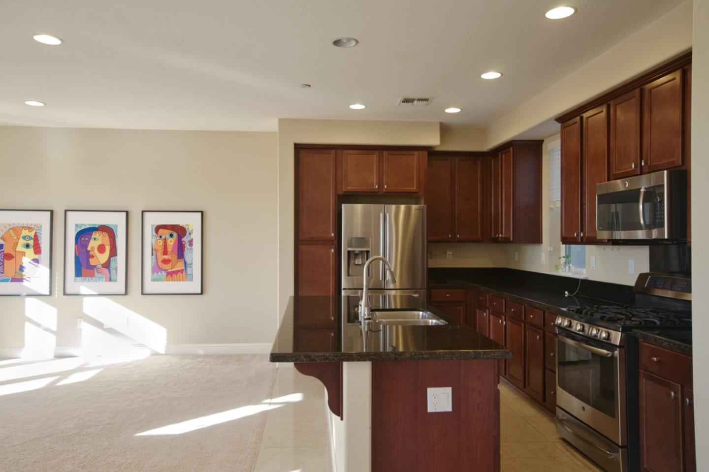 1579 Canal Street Milpitas, CA 95035 - Photo 16 of 36 a kitchen with stainless steel appliances granite countertop a refrigerator and a stove top oven