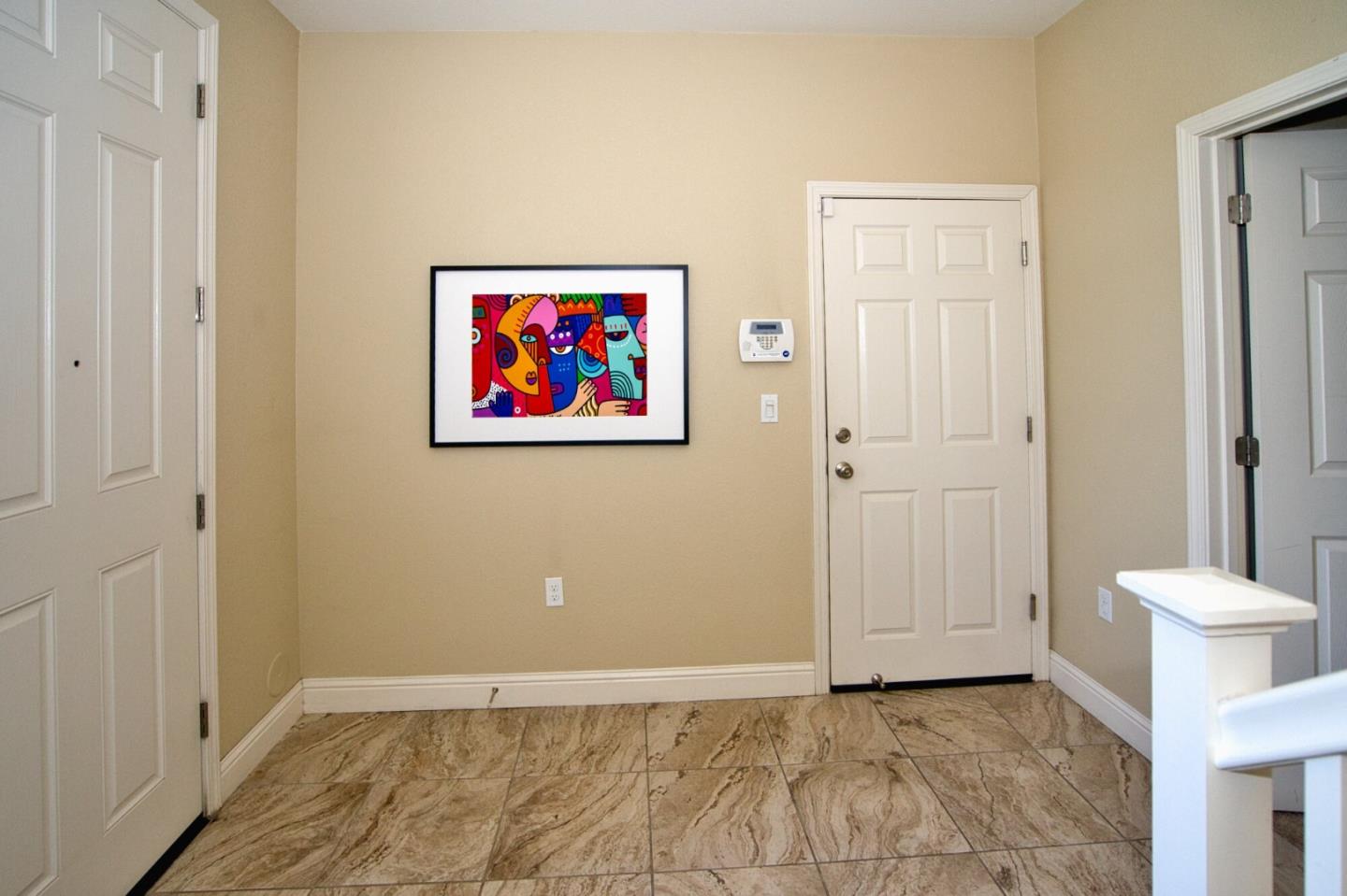 1579 Canal Street Milpitas, CA 95035 - Photo 2 of 36 an empty room with a painting on the wall