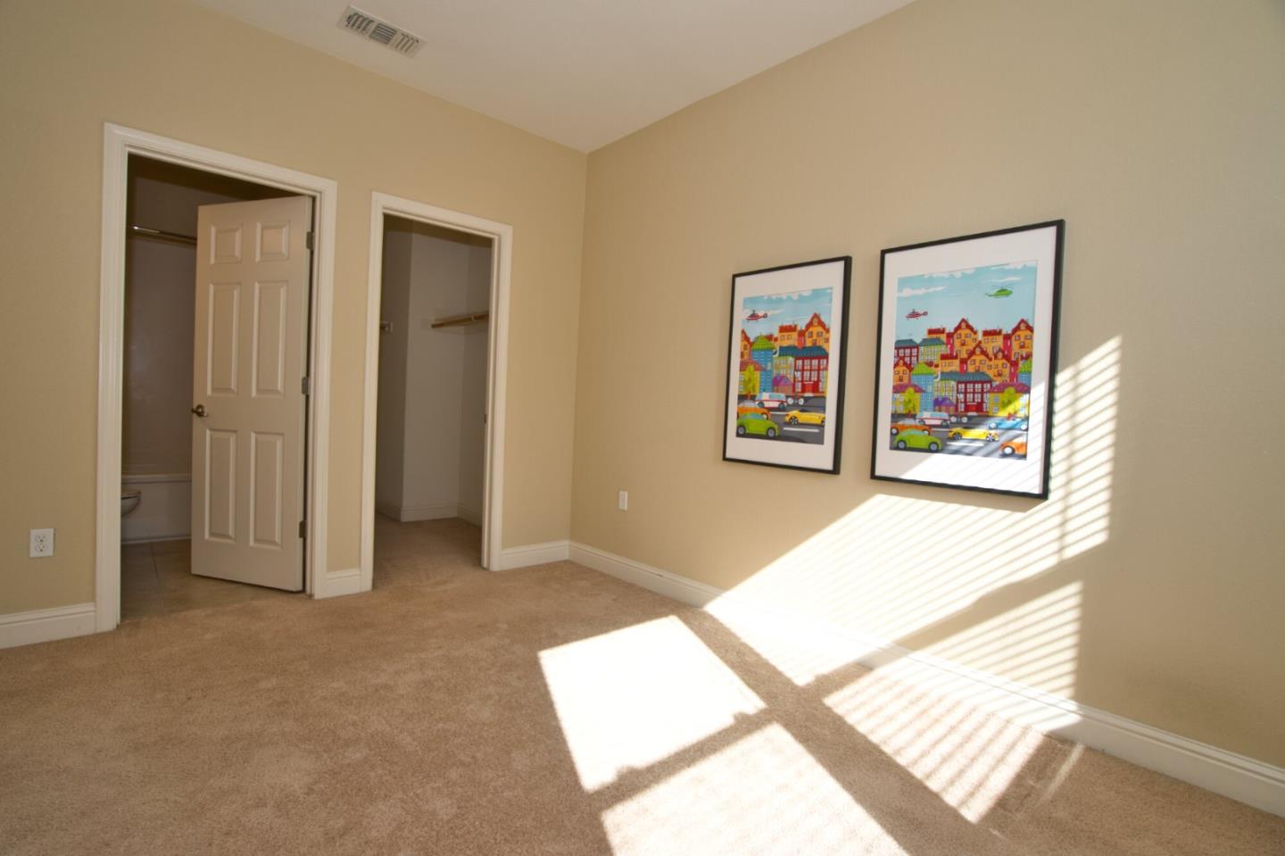 1579 Canal Street Milpitas, CA 95035 - Photo 30 of 36 a view of a hallway with paintings on the wall