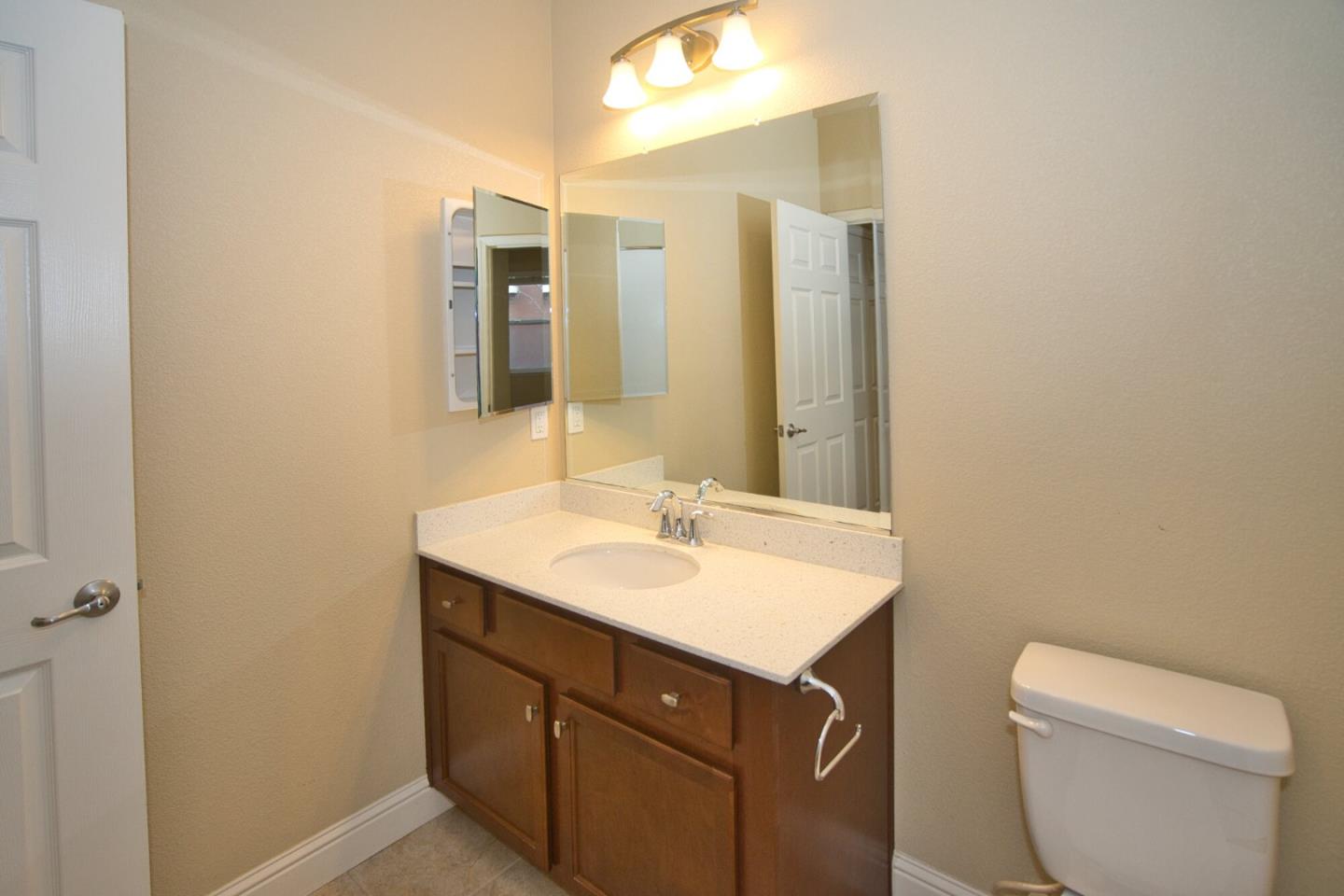 1579 Canal Street Milpitas, CA 95035 - Photo 5 of 36 a bathroom with a sink and a mirror