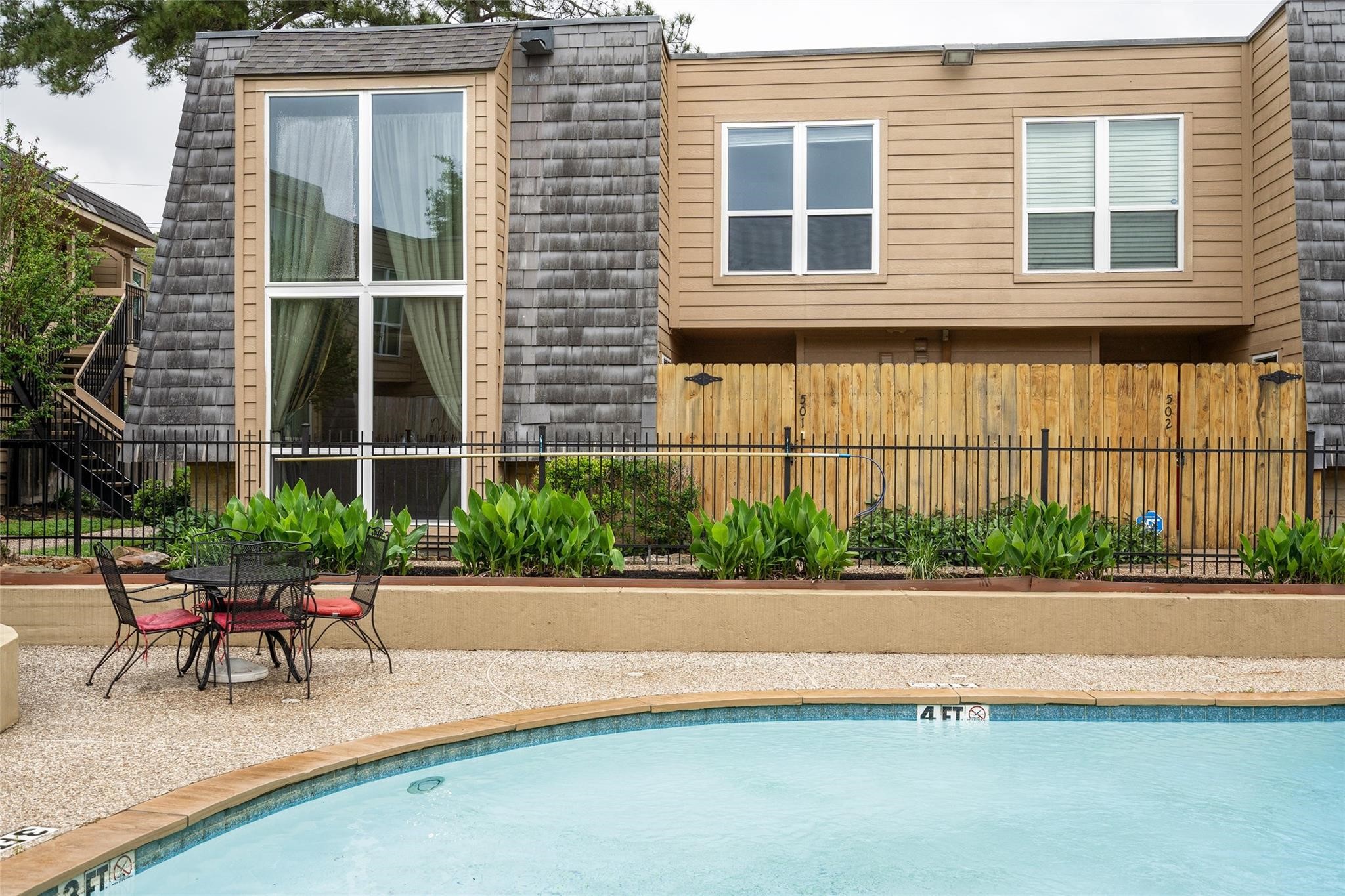 16120 Stuebner Airline Road, Unit 501 Spring, TX 77379 - Photo 10 of 23 a patio with a table and chairs and potted plants
