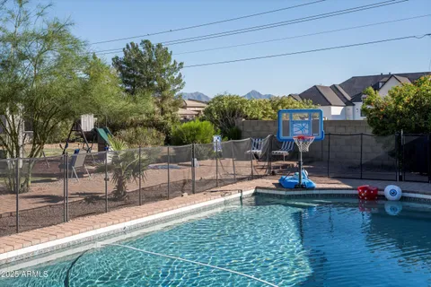 a view of swimming pool with outdoor seating