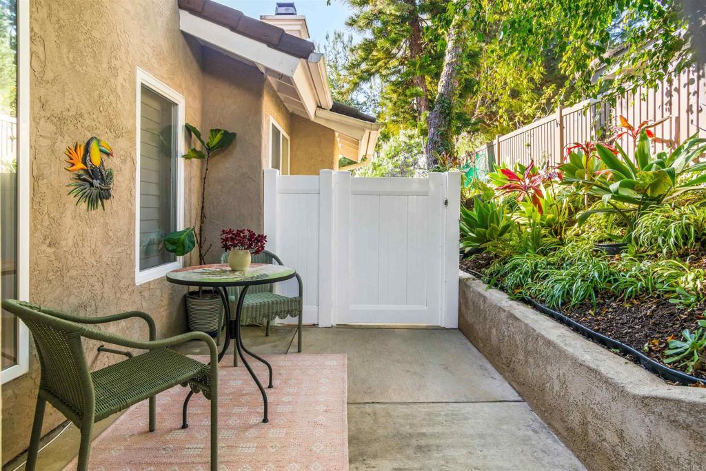 1622 Swallowtail Road Encinitas, CA 92024 - Photo 1 of 20 a backyard of a house with table and chairs