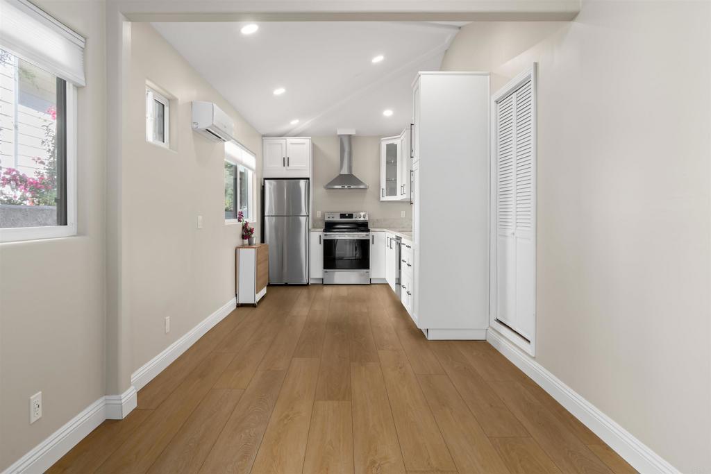 1622 Swallowtail Road Encinitas, CA 92024 - Photo 6 of 20 a view of a kitchen with a refrigerator and a stove top oven