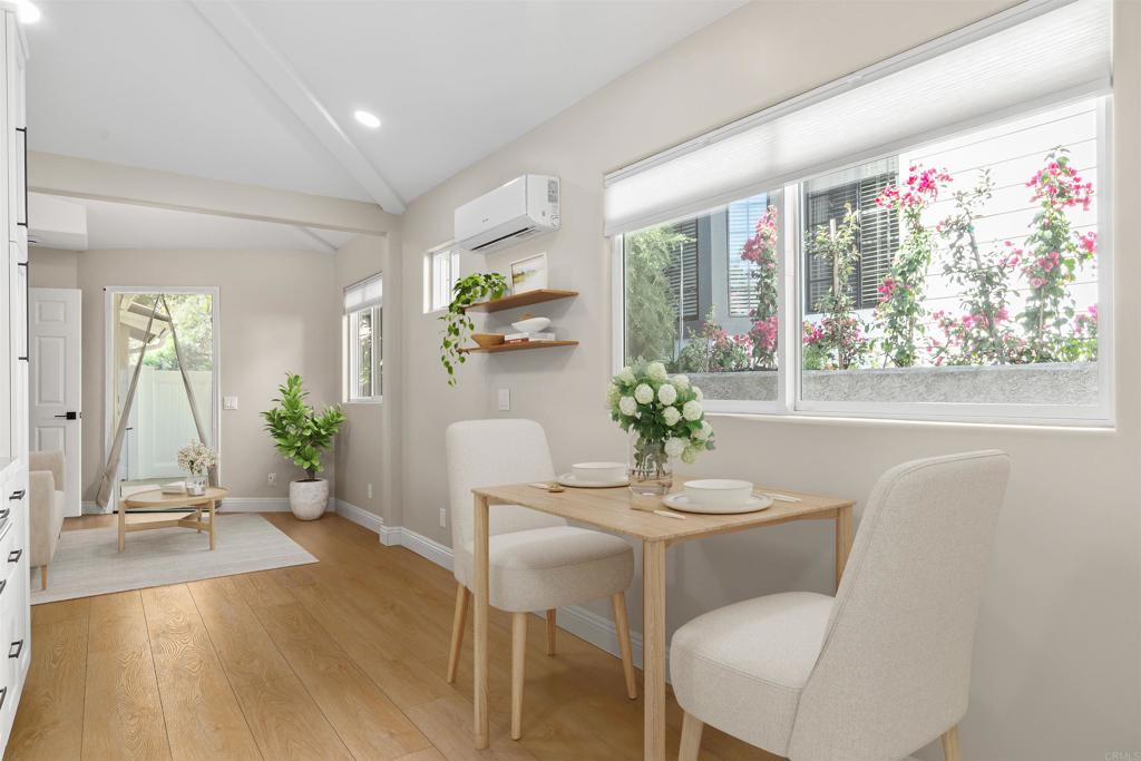 1622 Swallowtail Road Encinitas, CA 92024 - Photo 7 of 20 a dining room with furniture potted plants and wooden floor