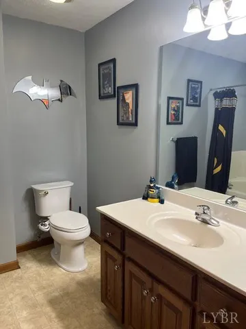 a bathroom with a sink double vanity and a toilet