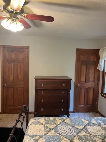 a room with a dresser and a mirror