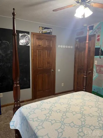 a view of hallway with stairs and wooden floor