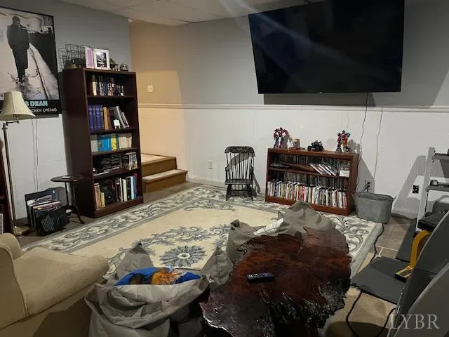 a bedroom with a bed and a television