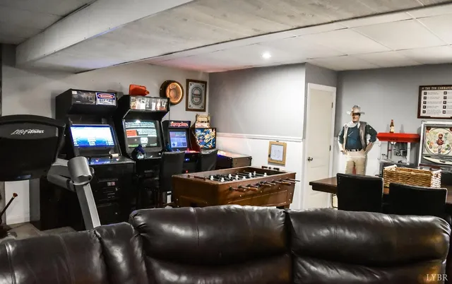 a bedroom with furniture and a book shelf