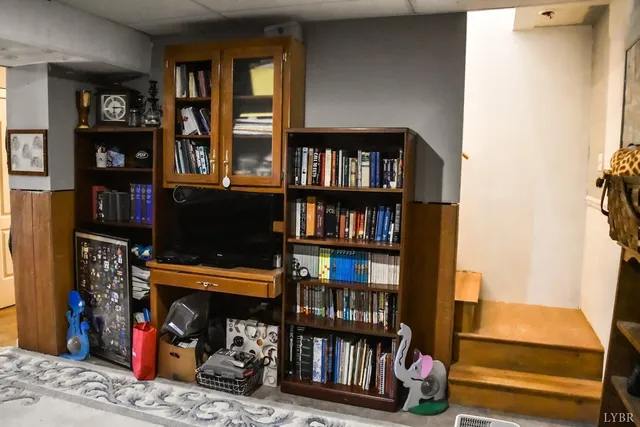 a view of a workspace with furniture and window