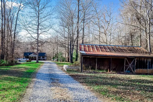 a view of a house with a yard balcony and sitting area