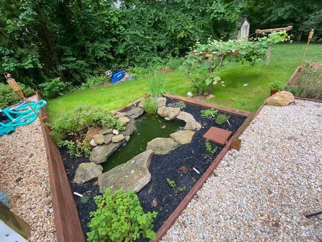 a view of a garden with an outdoor seating