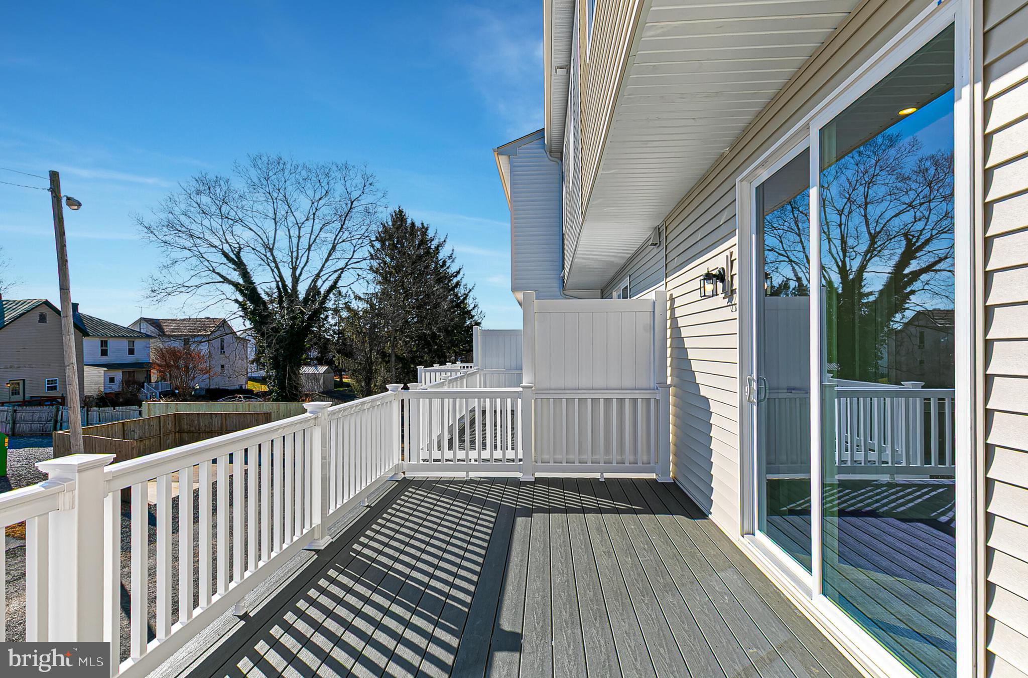 64 B Oasis Avenue Ranson, WV 25438 - Photo 17 of 38 a view of a wooden deck