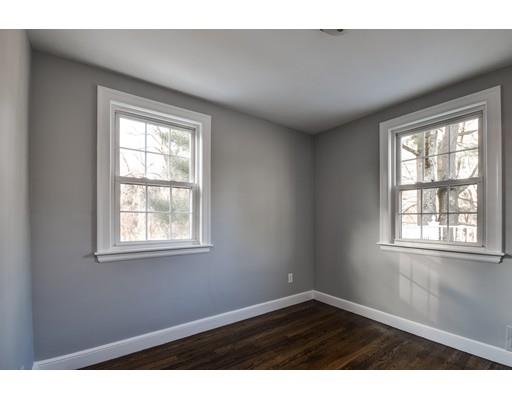 118 Concord Road Wayland, MA 01778 - Photo 20 of 28 an empty room with wooden floor and windows