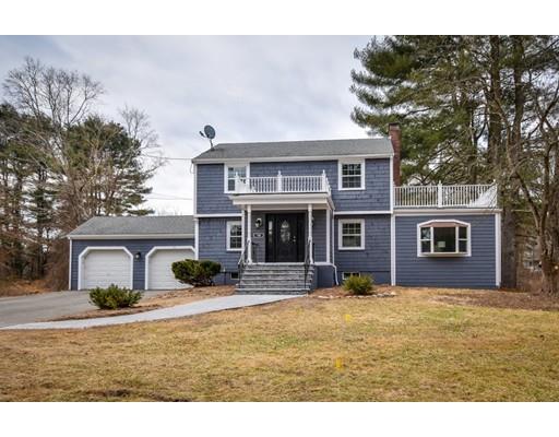 118 Concord Road Wayland, MA 01778 - Photo 2 of 28 a front view of a house with yard and trees