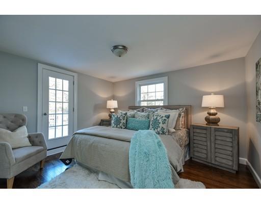 118 Concord Road Wayland, MA 01778 - Photo 21 of 28 a bedroom with a bed a couch and windows