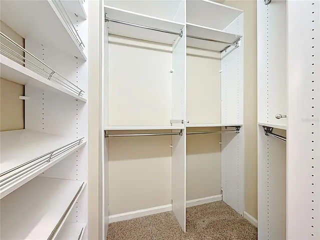 an aerial view of multiple houses with a lake view