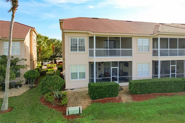 an aerial view of residential houses with outdoor space and river