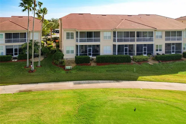 an aerial view of a house with outdoor space lake view