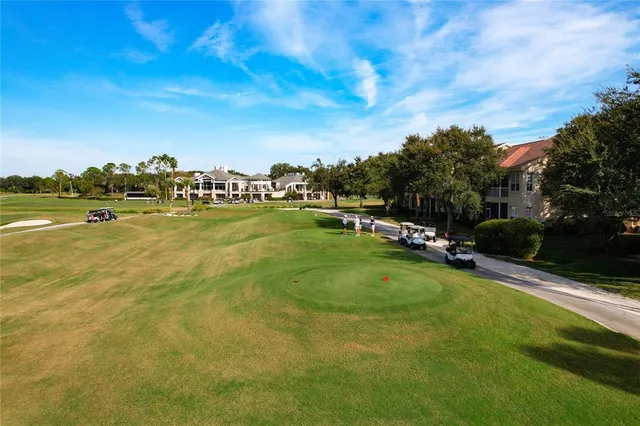 an aerial view of a house with outdoor space swimming pool