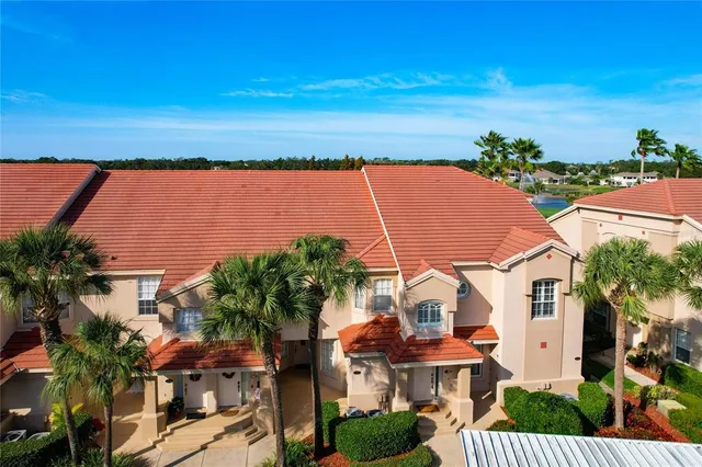 an aerial view of a houses with outdoor space